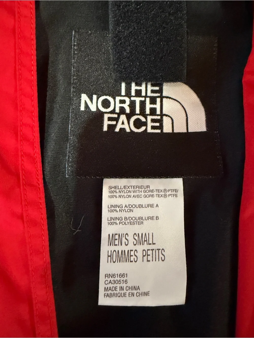 The North Face Red and Black Hooded Raincoat